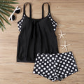 Black women's polka dot swimsuit with high-waist boxer brief bottoms.
