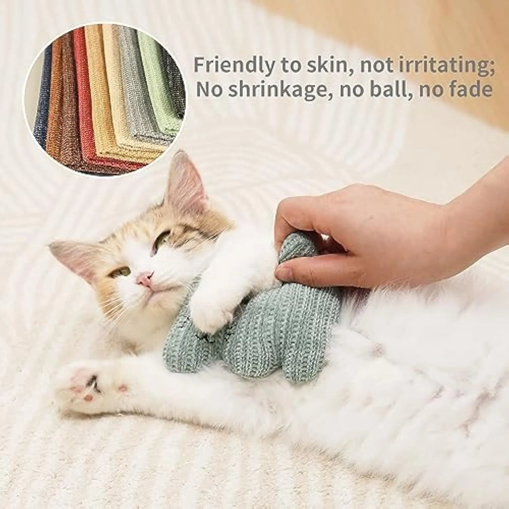Cyan knitted plush cat toy with rope ends, measuring 12cm, containing a bell and organic catnip.