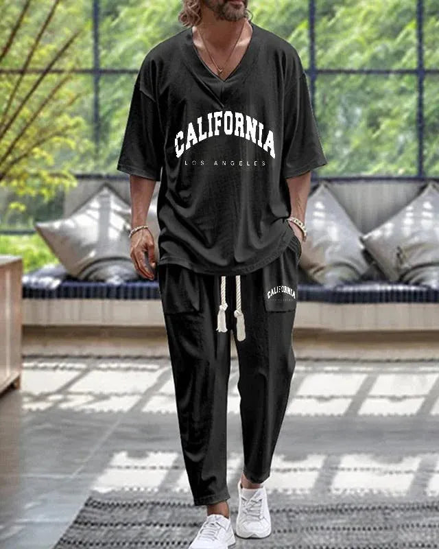 Cropped sleeve V-neck trousers suit set in thin polyester fabric on a hanger.