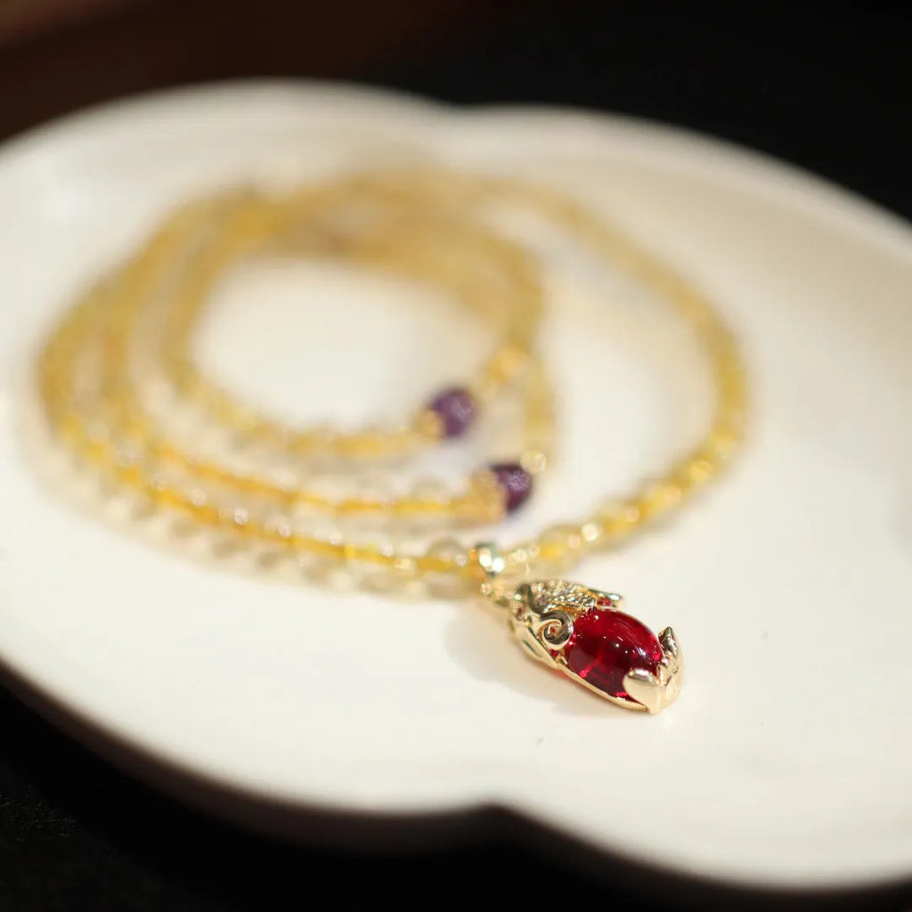 Brazilian Rutilated Quartz bracelet with gold beads and hanging chopsticks pendant