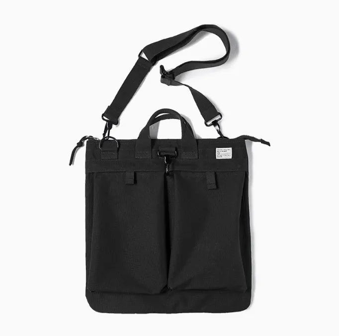 Canvas crossbody messenger bag in military green with shoulder strap showing vertical square shape and zipper closure