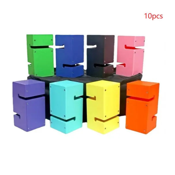 Set of coloured ABS plastic tower blocks with pull ropes and metal hook frame for outdoor team building games.