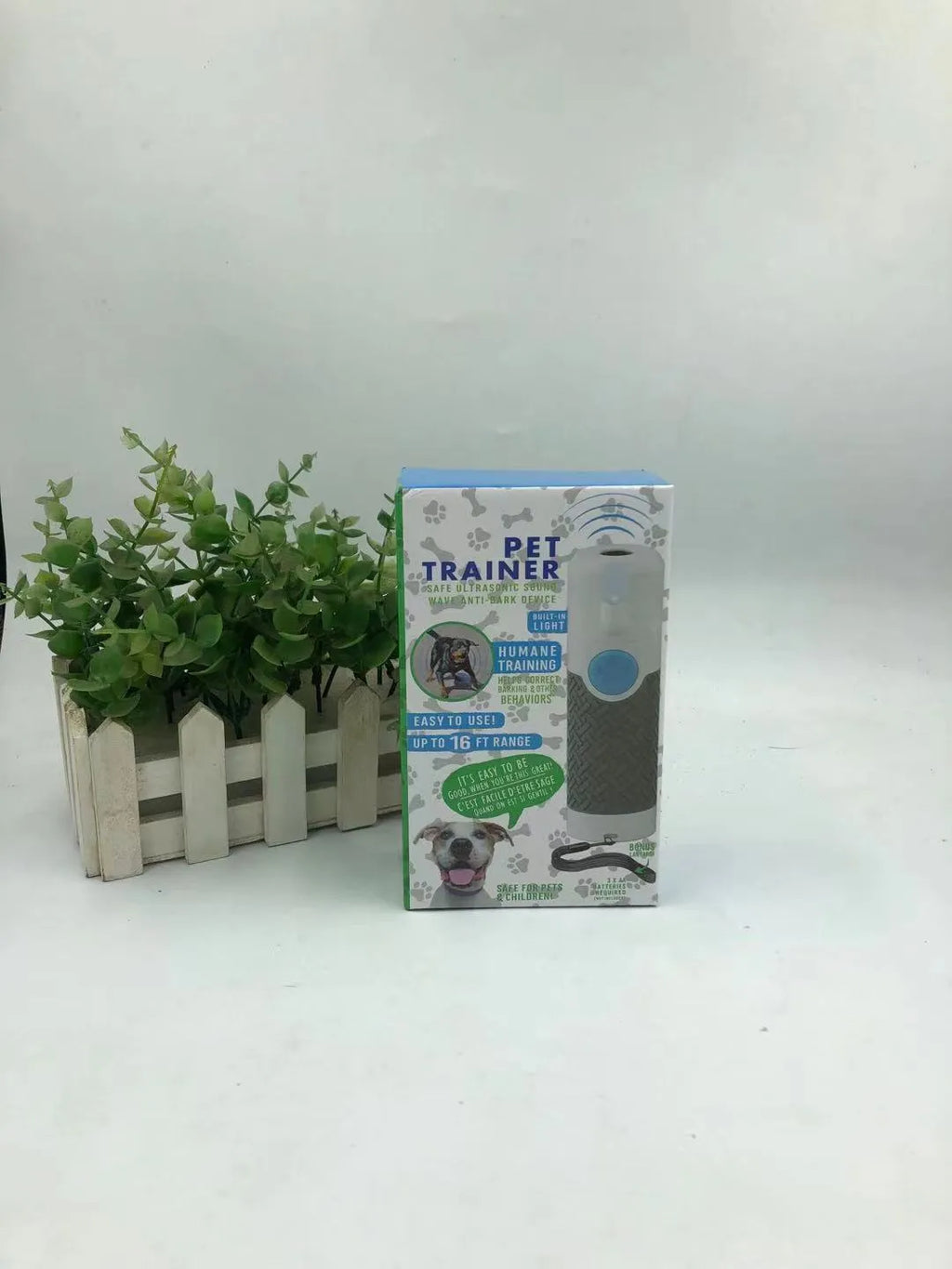 White handheld ultrasonic dog trainer device for barking control and behaviour correction