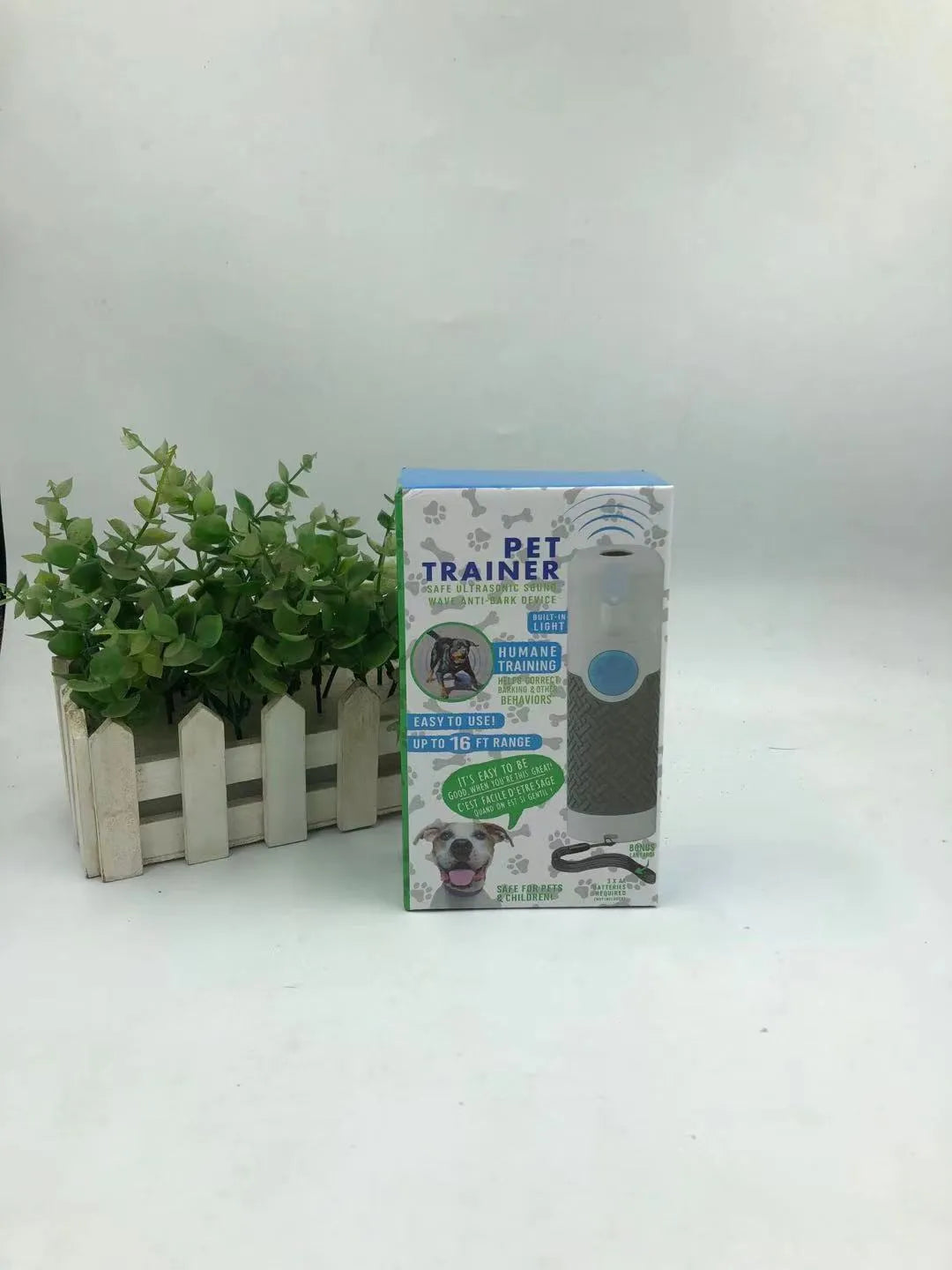 White handheld ultrasonic dog trainer device for barking control and behaviour correction
