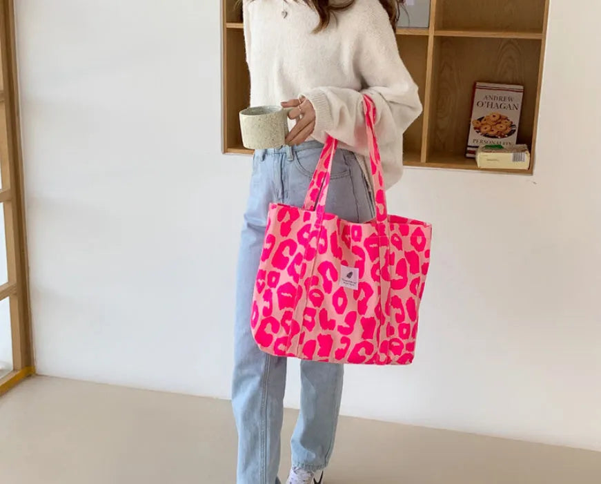 Large capacity Oxford cloth shoulder bag for women with a three-dimensional front pocket.