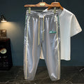 Men's black cotton harem pants with a loose fit and mid waist
