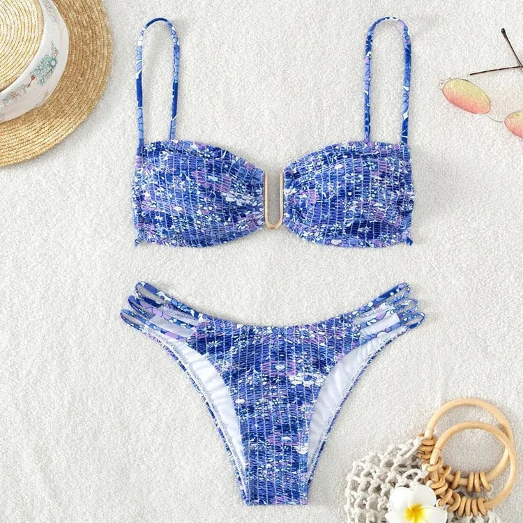 Women's high-waist floral bikini swimsuit on a hanger in blue, orange, pink, and rose red colours.