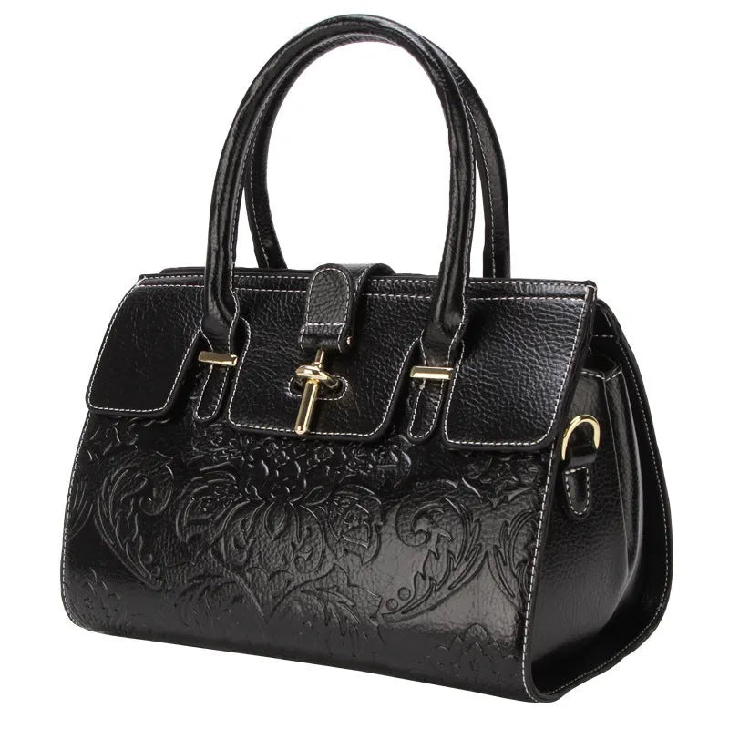 Genuine leather vintage crossbody bag with oval shape and embossed pattern in black colour