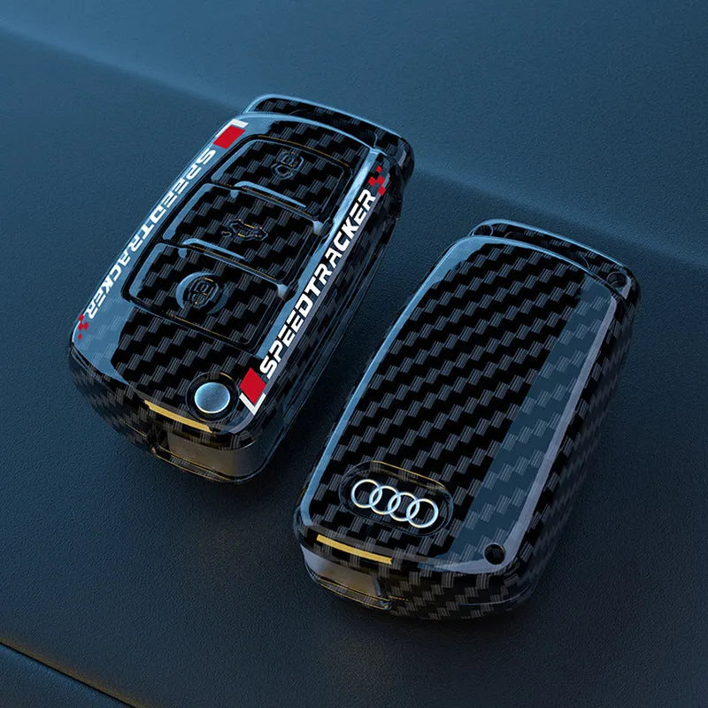 Carbon fibre style car key holder cover in white and carbon colour options with a small mirror.