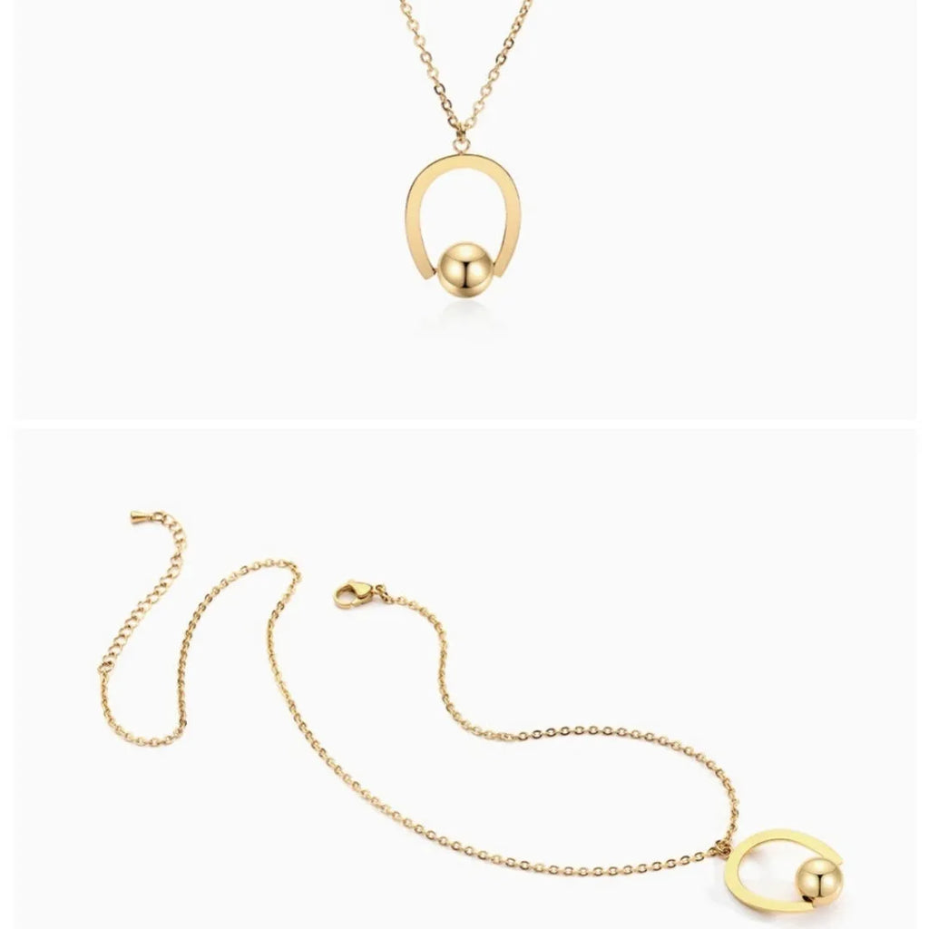 Stainless steel necklace with geometric pendant on a cross chain, in gold or silver colour.