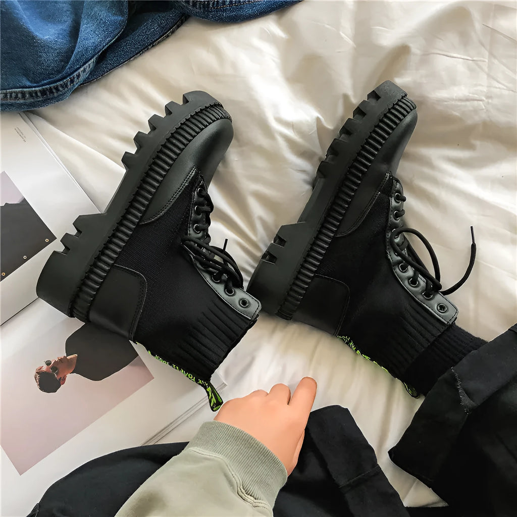 Men's black high-top platform boots with a zip fastener and lace-up detail, made from frosted cowhide leather.