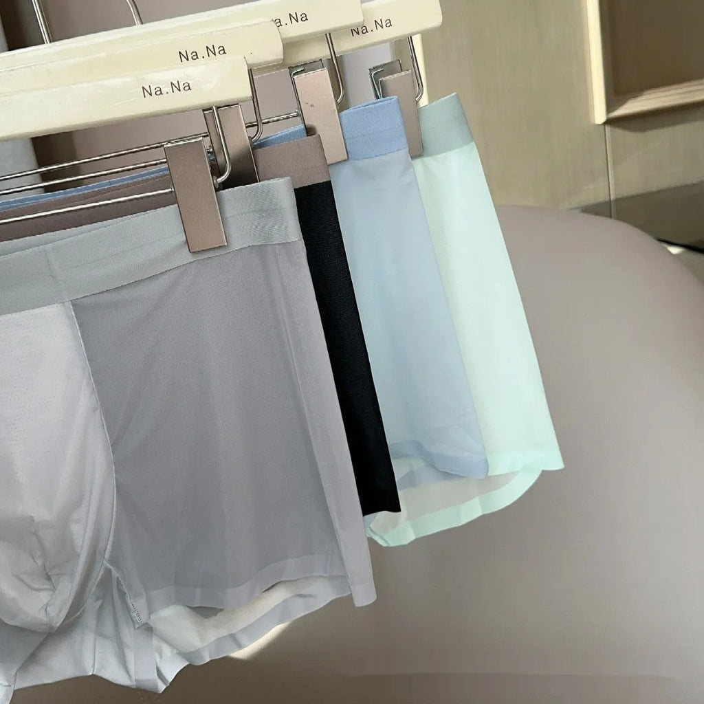 Ultra-thin seamless men's boxers in ice silk nylon with a honeycomb crotch, shown in black.