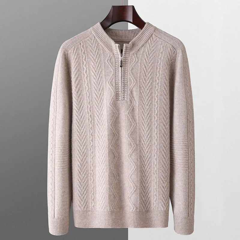 Man wearing a milky white half-zip wool sweater with a diamond pattern, showing loose fit and long sleeves.