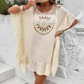 Crochet patchwork beach dress swimsuit cover-up in apricot colour with tassel details.