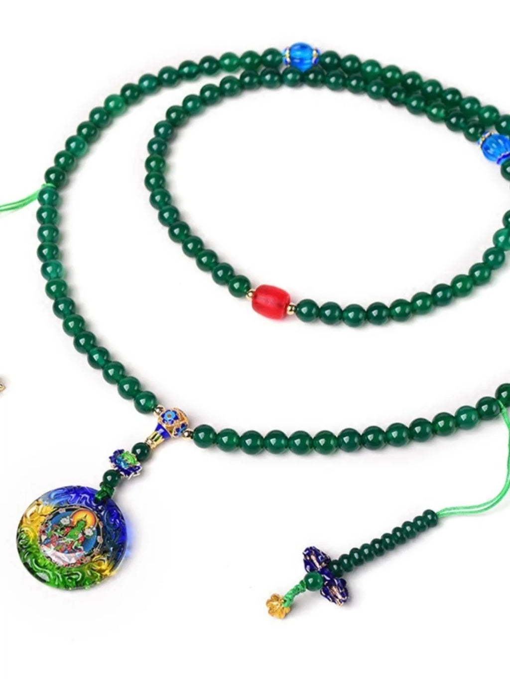 Natural green agate 108-bead bracelet with pendant in Thangka style on a wrist.