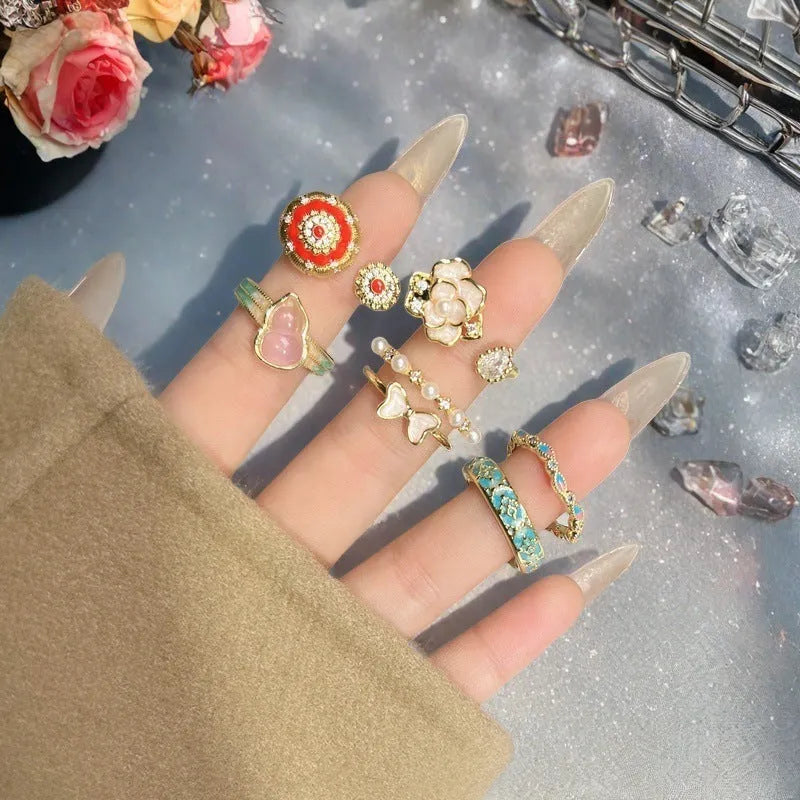 Adjustable copper gourd ring with flower and bow design in New Chinese style featuring inlaid zircon stones