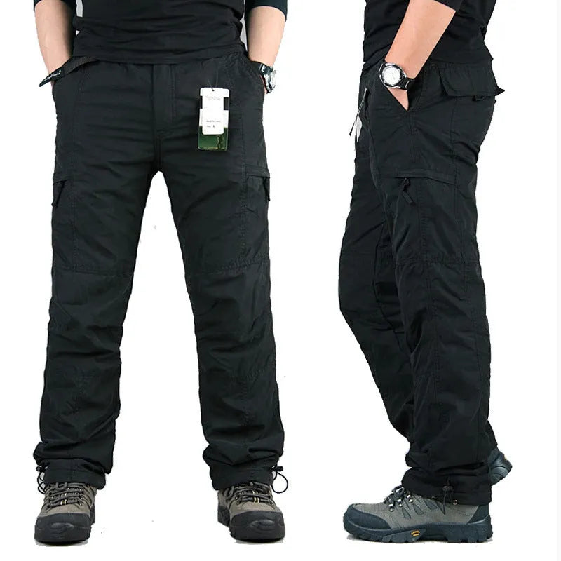 Men's stonewashed cotton overalls with a thick wool lining in khaki, shown with a loose straight-leg fit.