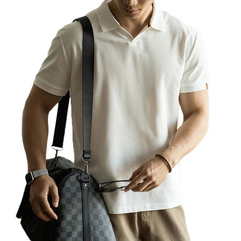 Man's blue American-style short-sleeved cotton blend polo shirt on a hanger.