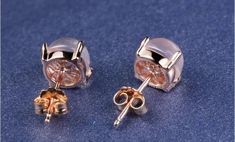 Rose gold Korean style stud earrings with synthetic Ross quartz and crystal inlay in drop shape