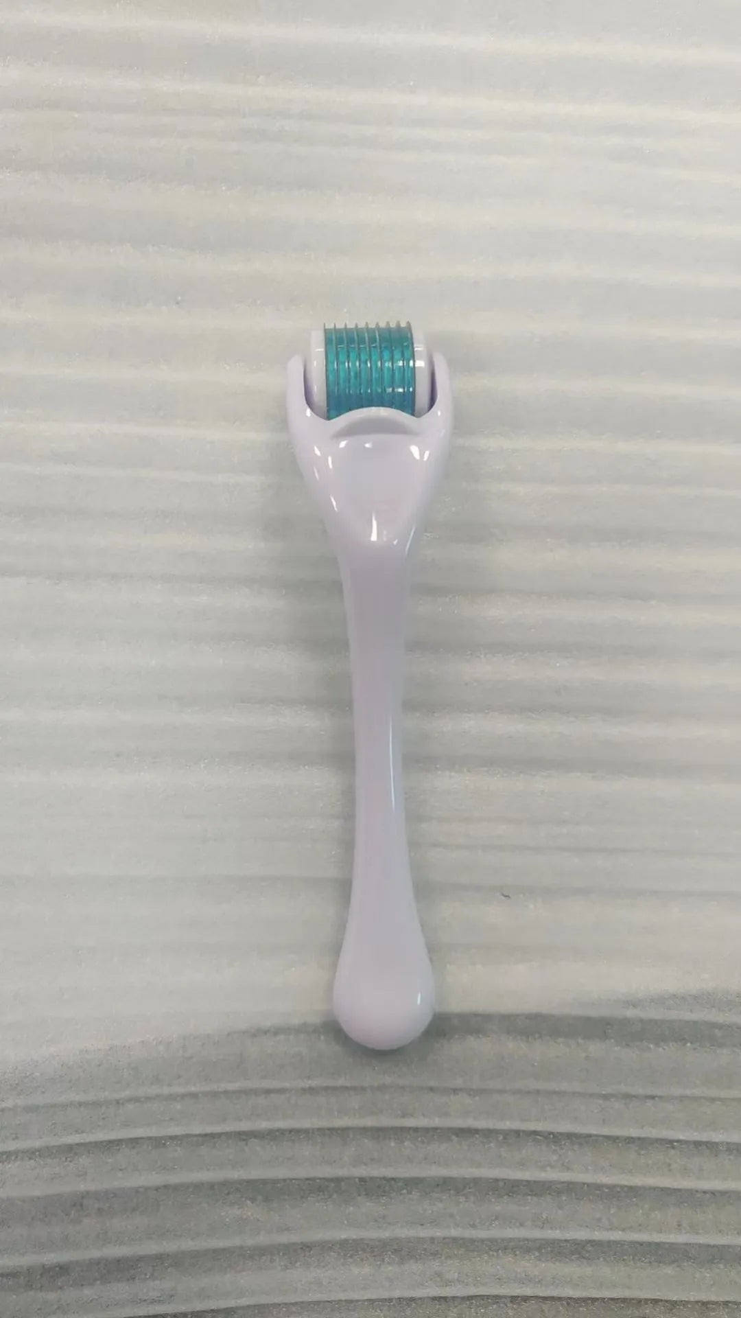 540 micro needle derma roller showing handle and needle wheel in a selected colour