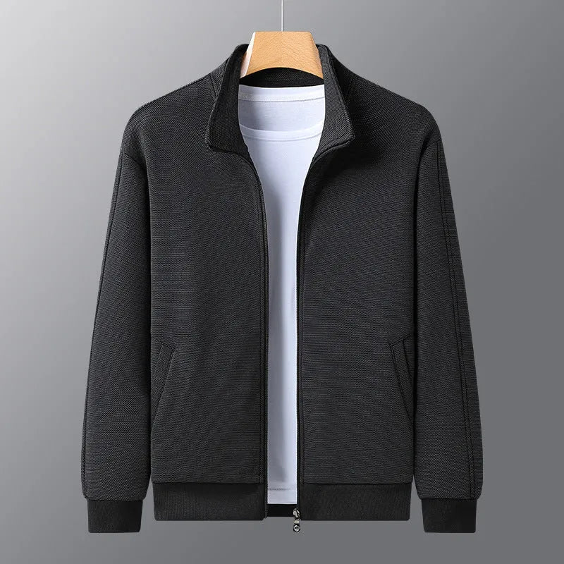 Men's black athletic jacket with a stand-up collar and front zip, showing a close-fitting cut