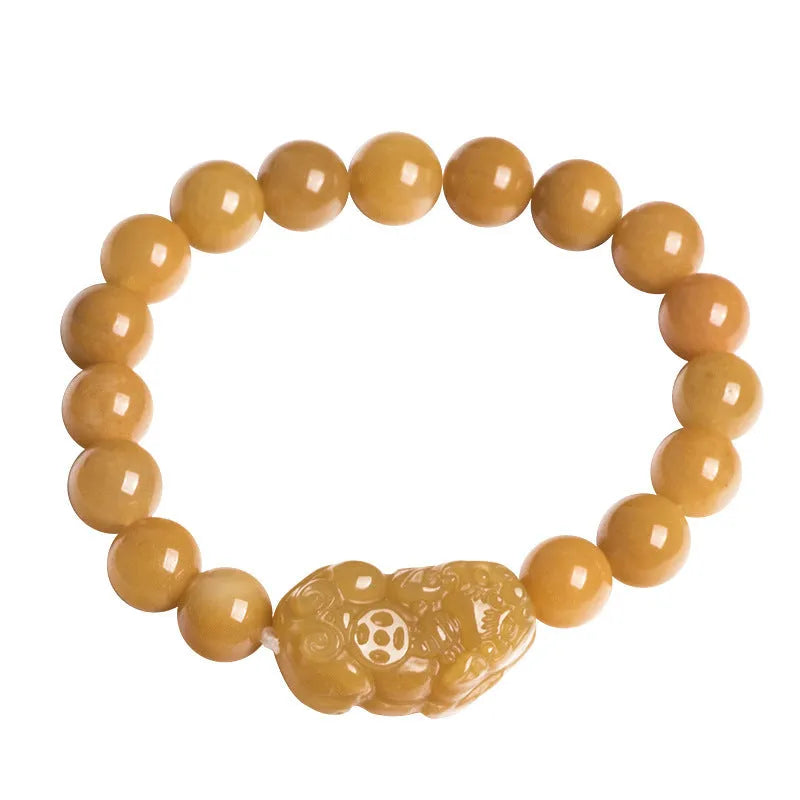 Carved Jinsi Jade money bracelet in Golden Thread Jade colour showing texture and bead detail.