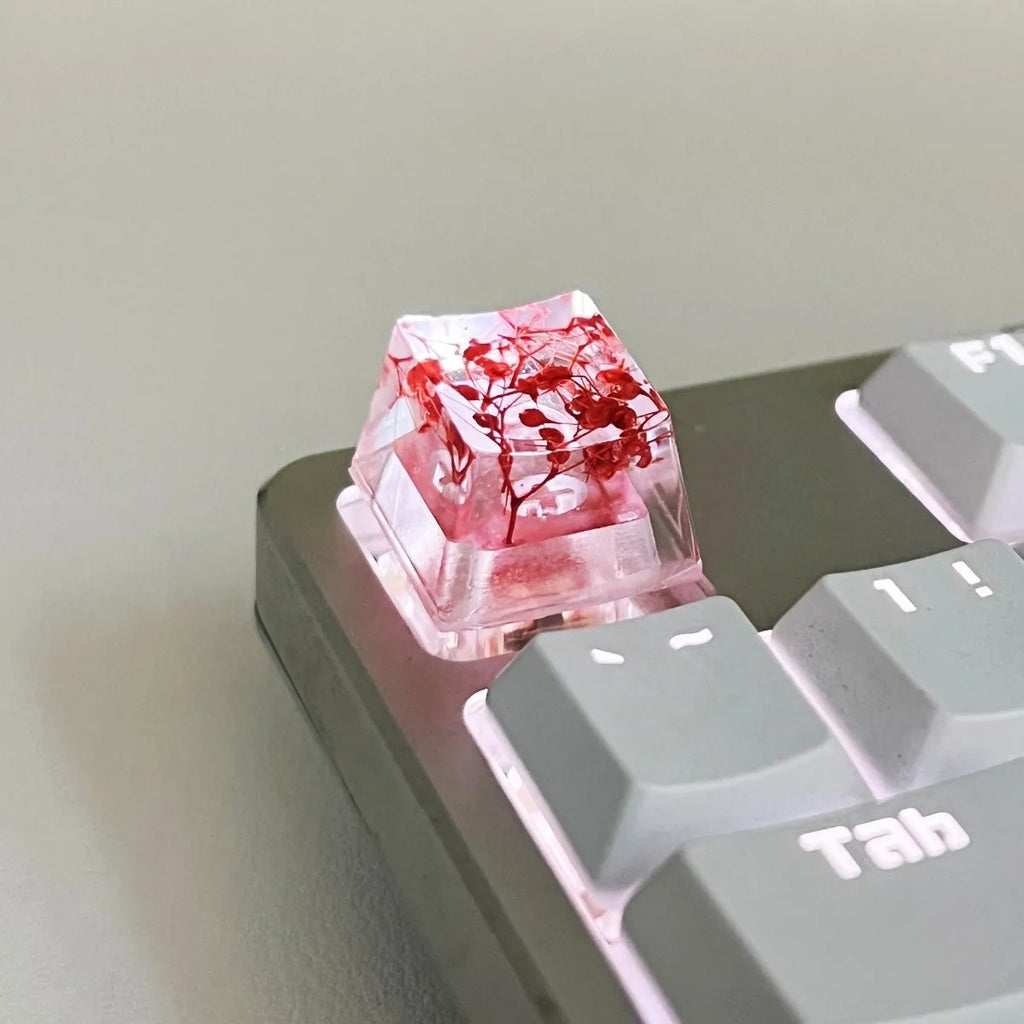 Resin starry sky artisan keycap in green, pink, red, or violet for mechanical keyboard customisation.