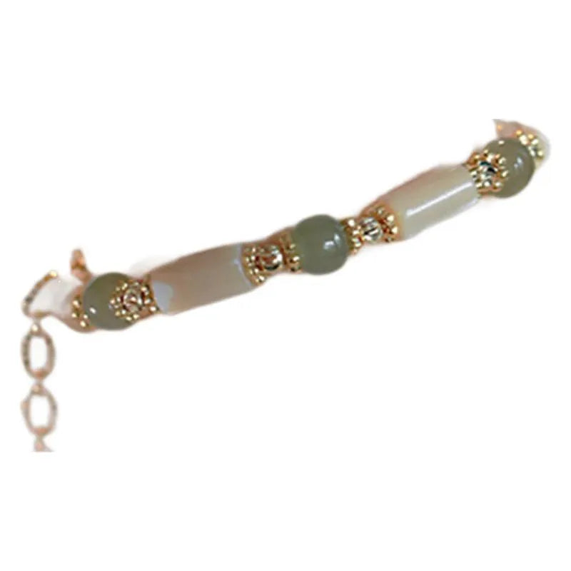 Hetian Jade white lip shell bead bracelet with round beads on wrist