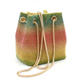 Rhinestone-decorated rainbow bucket bag with shoulder strap on a soft fabric base