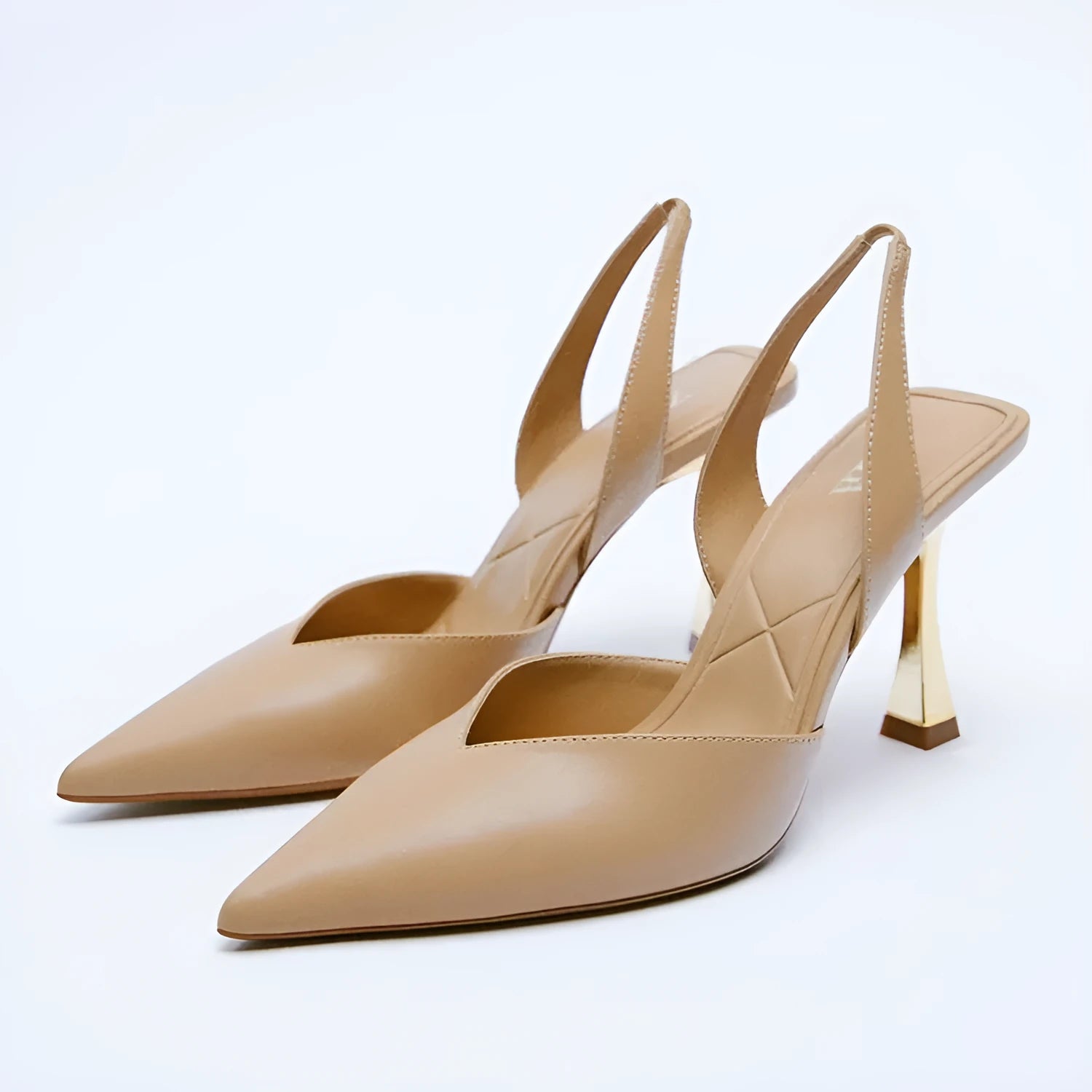 Women's pointed patent leather high heels in nude apricot colour with shallow cut design