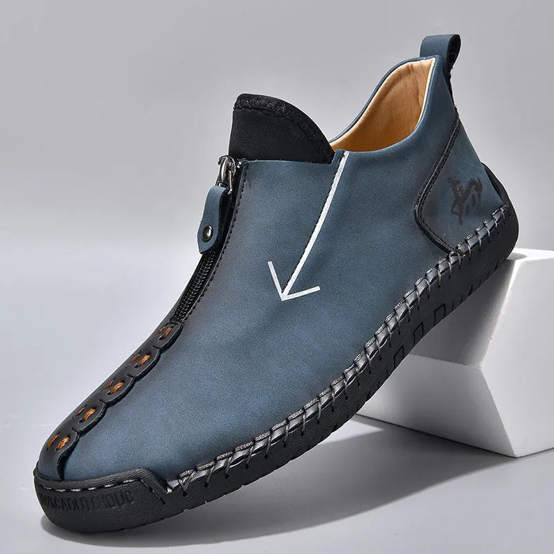 Men's brown leather-look zip-up martin boots with a round toe and rubber sole on a white background.