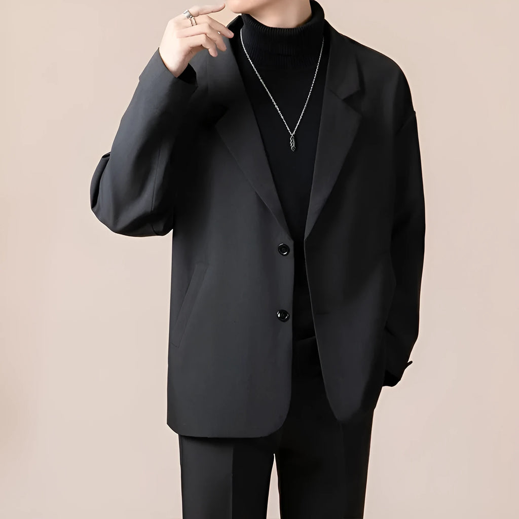 A man's loose-fit casual suit jacket in a polyester blend fabric, shown in one of four available colours.