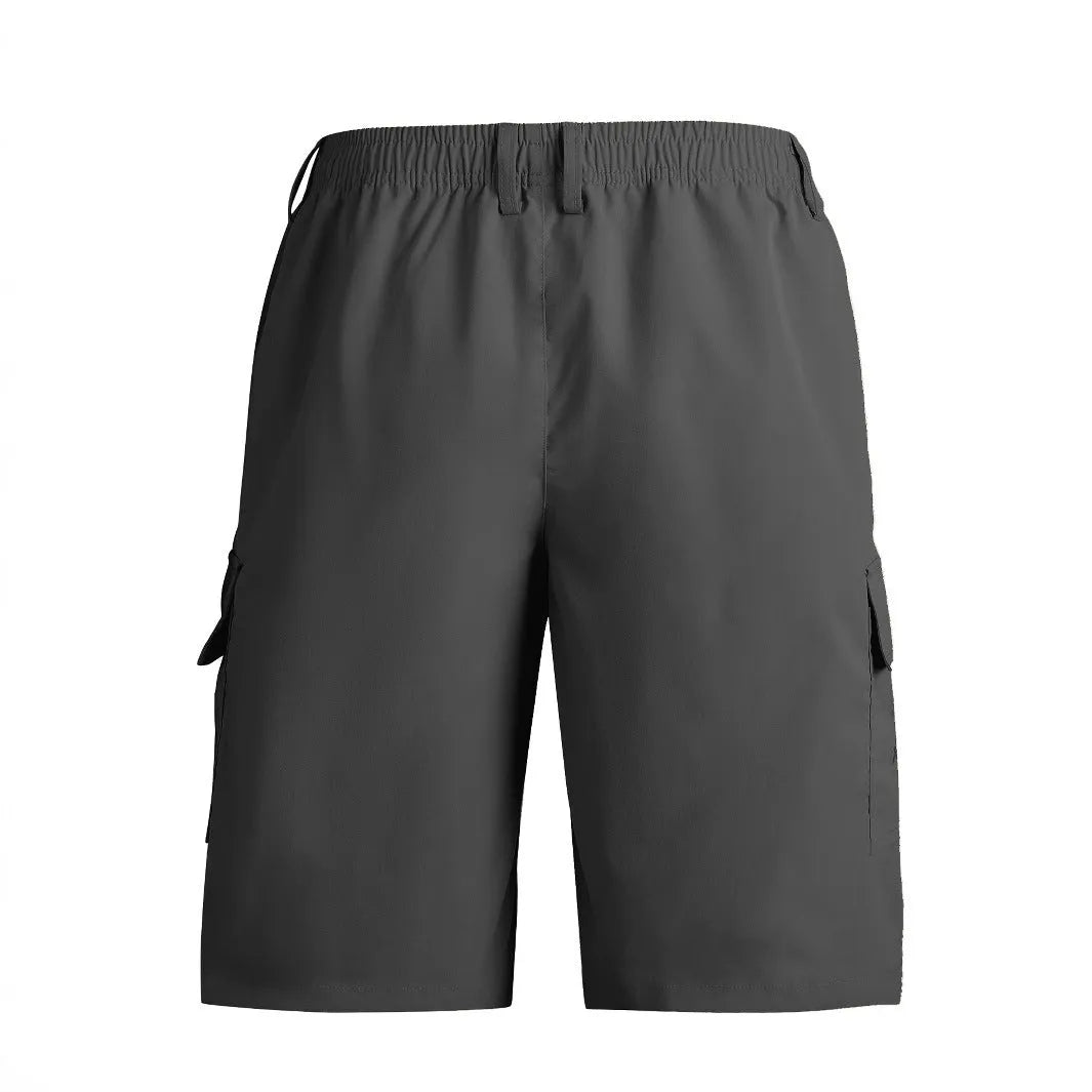 Man wearing loose straight-leg casual shorts in blue, showing the relaxed fit and straight cut.
