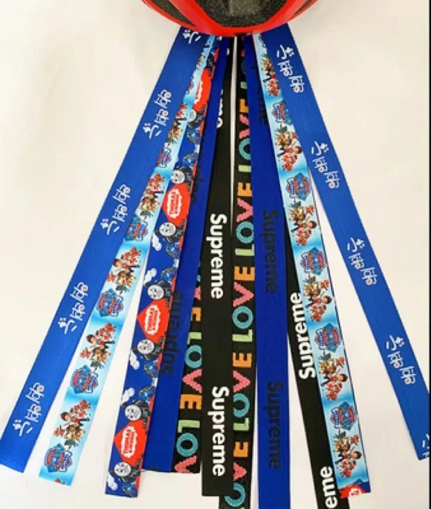 Children's decorative helmet streamer ribbon in multiple colours for roller skating and skiing safety gear.