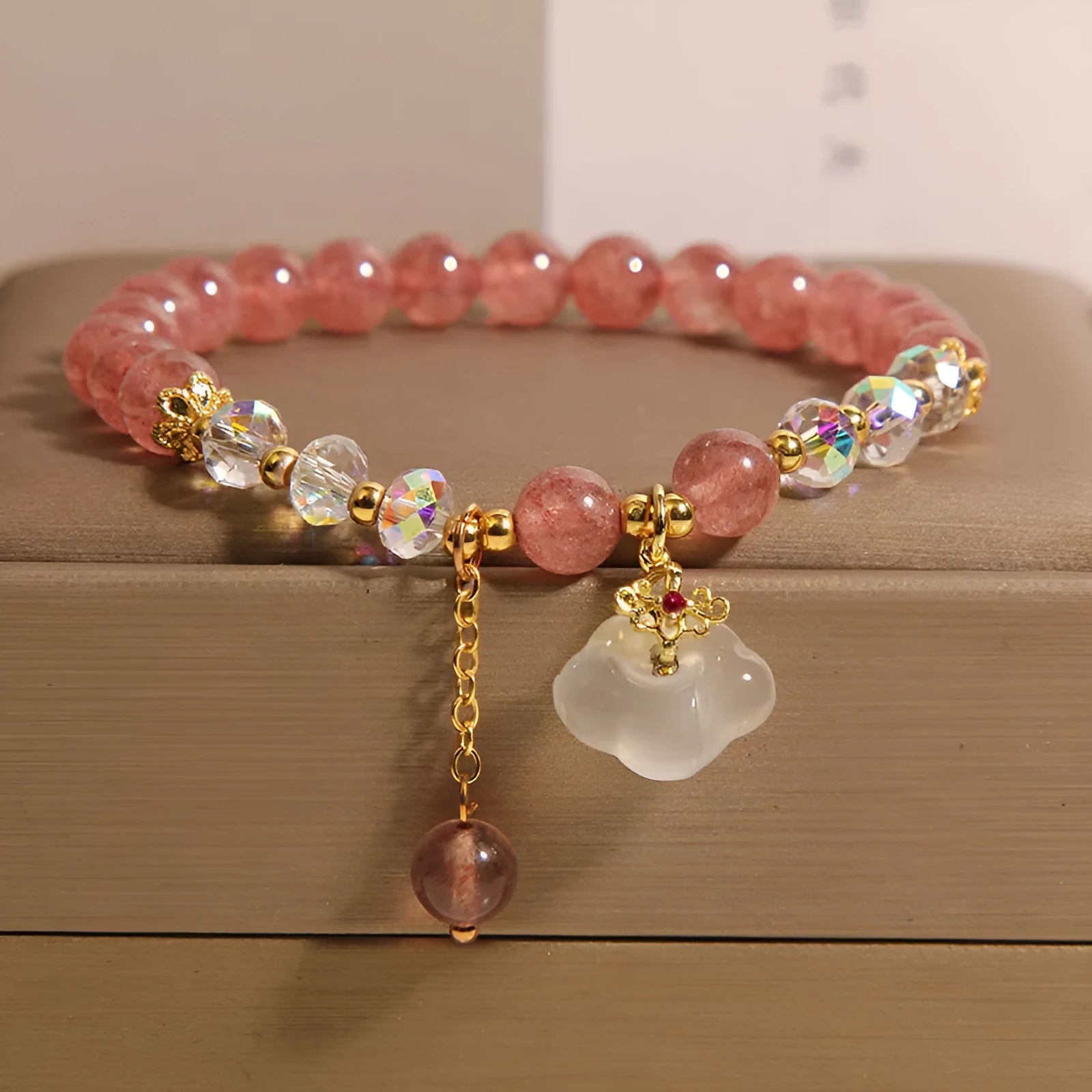 Women's natural crystal bracelet with strawberry quartz and white agate beads in auspicious clouds pattern