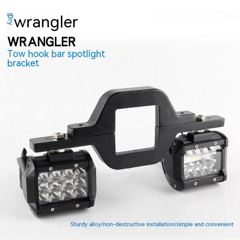 Black aluminium alloy LED reverse light mounting bracket for a Jeep Wrangler.