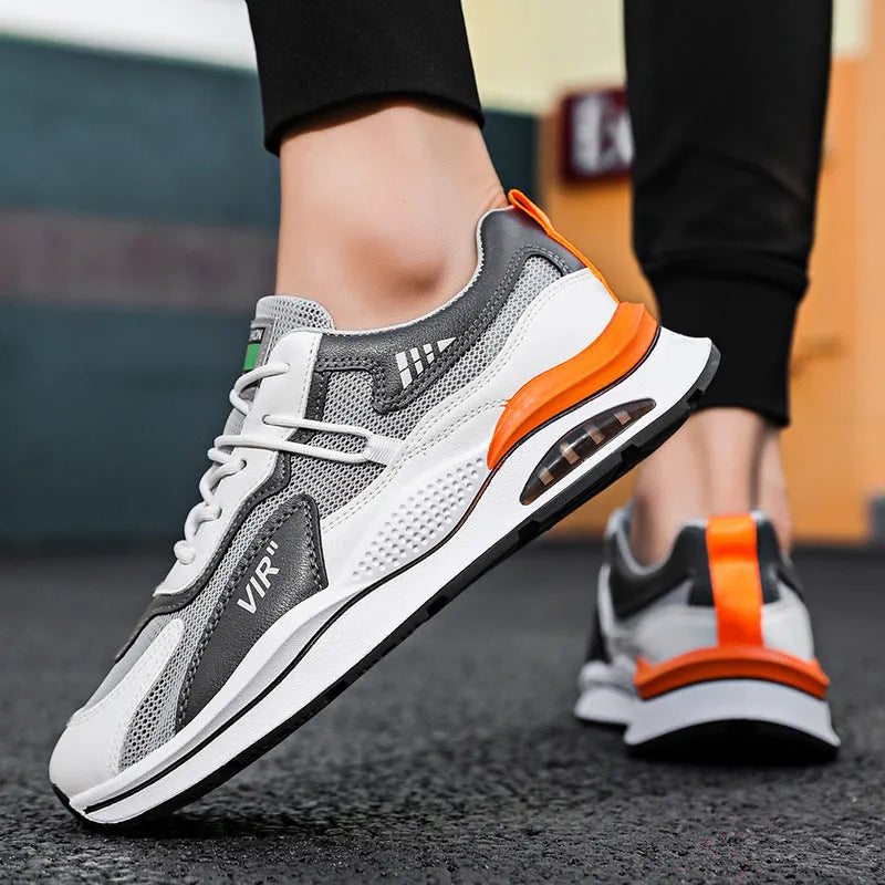 Men's gray and black mesh running shoes with a round toe and middle-top design on a white background.