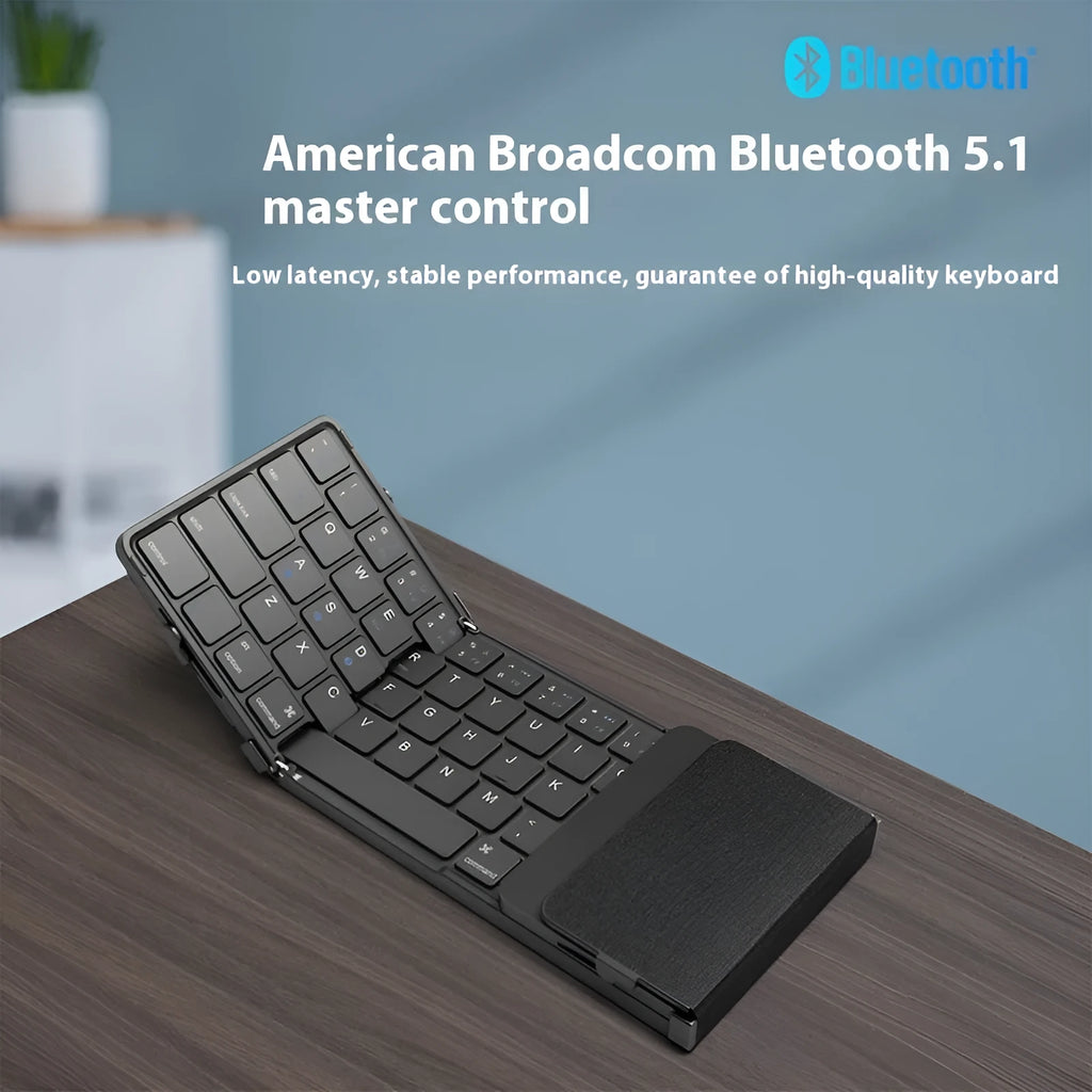 Black folding Bluetooth keyboard collapsed to compact size for mobile phones and tablets