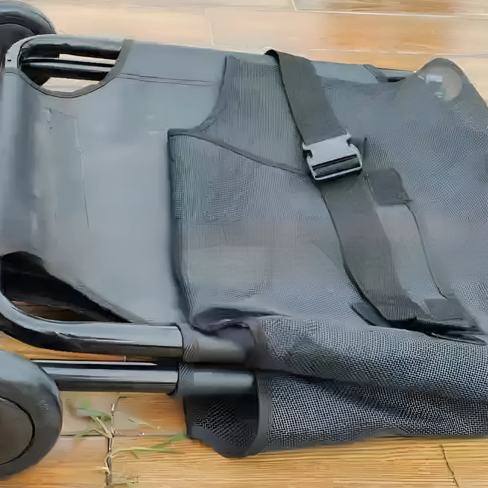 Large black aluminium alloy foldable pet stretcher for emergency dog transfer and rescue.
