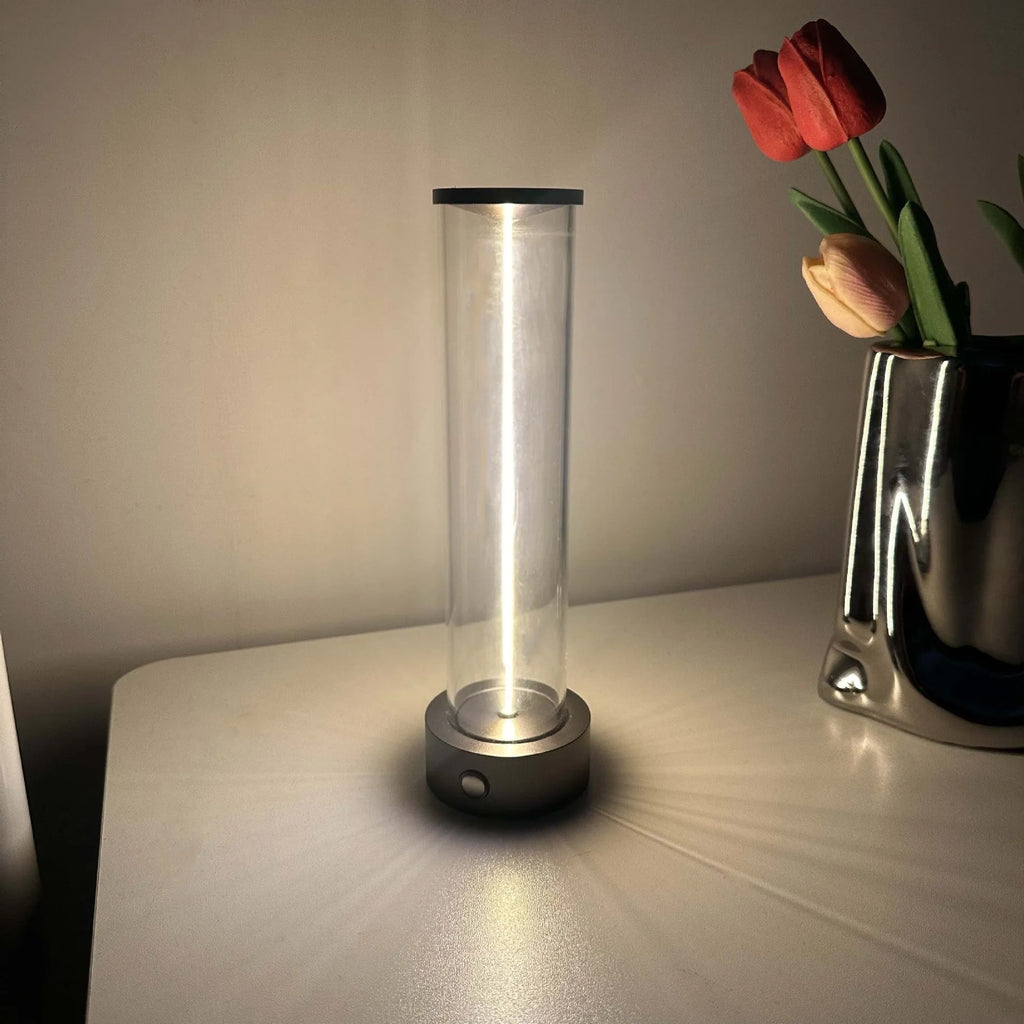Modern glass and metal LED line light strip with magnetic back for USB-charged night lighting