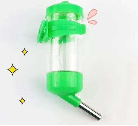 Green plastic ball kettle pet water feeder mounted on a small animal cage bars.