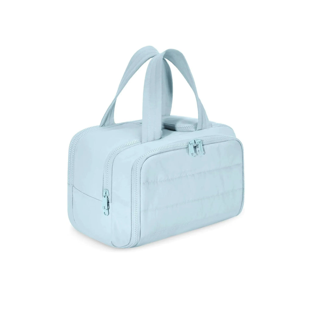 Large fluffy travel toiletry bag with wide open top, shown in a choice of colours.