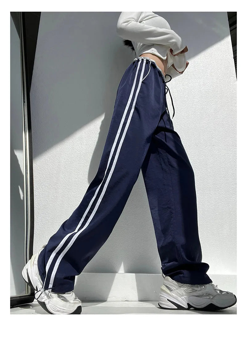 Women's navy blue loose straight trousers with white ribbon parallel bar waistband detail