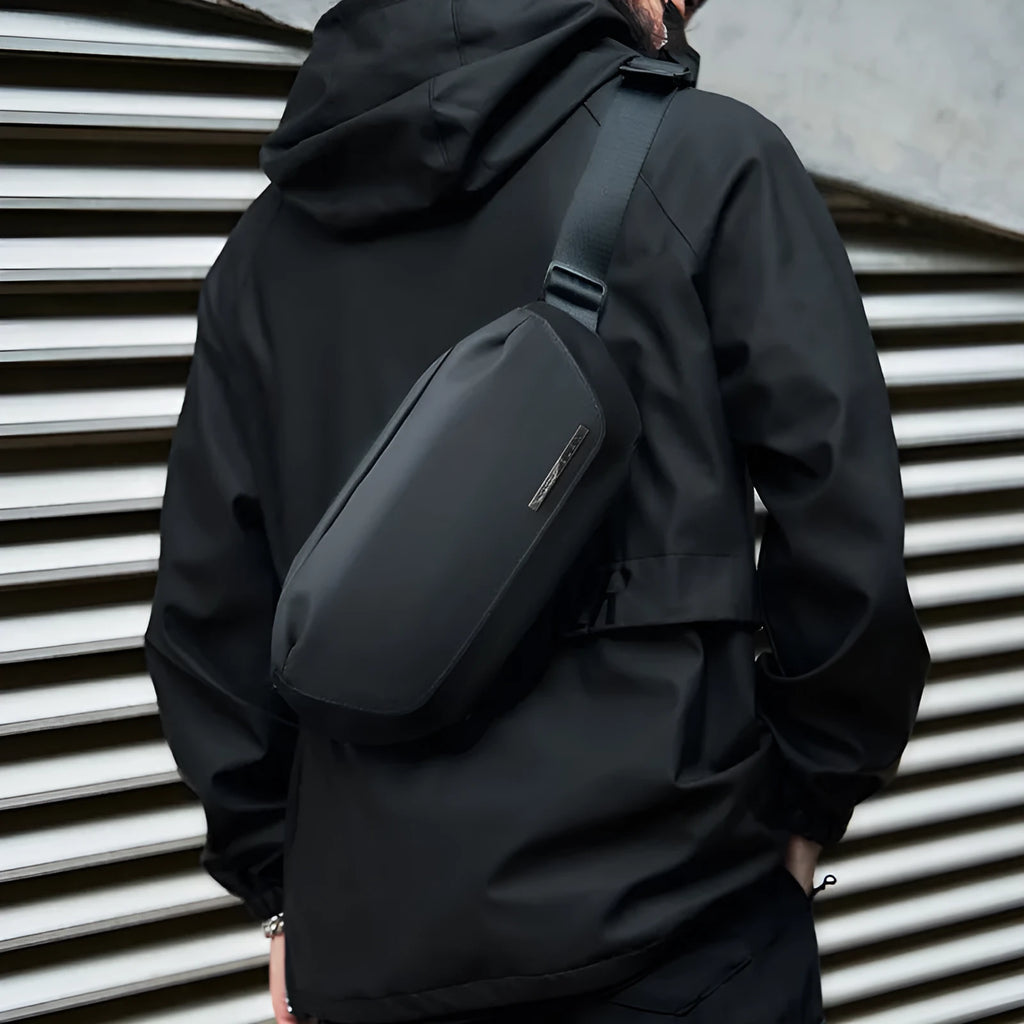 Black Oxford cloth messenger bag for men with one-shoulder strap design.