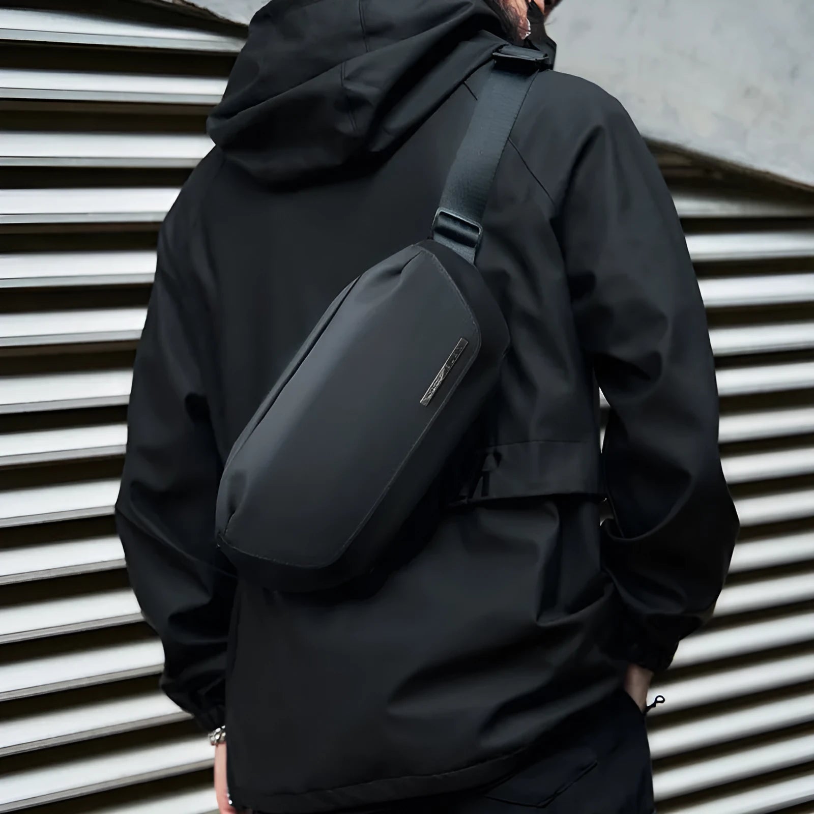 Black Oxford cloth messenger bag for men with one-shoulder strap design.