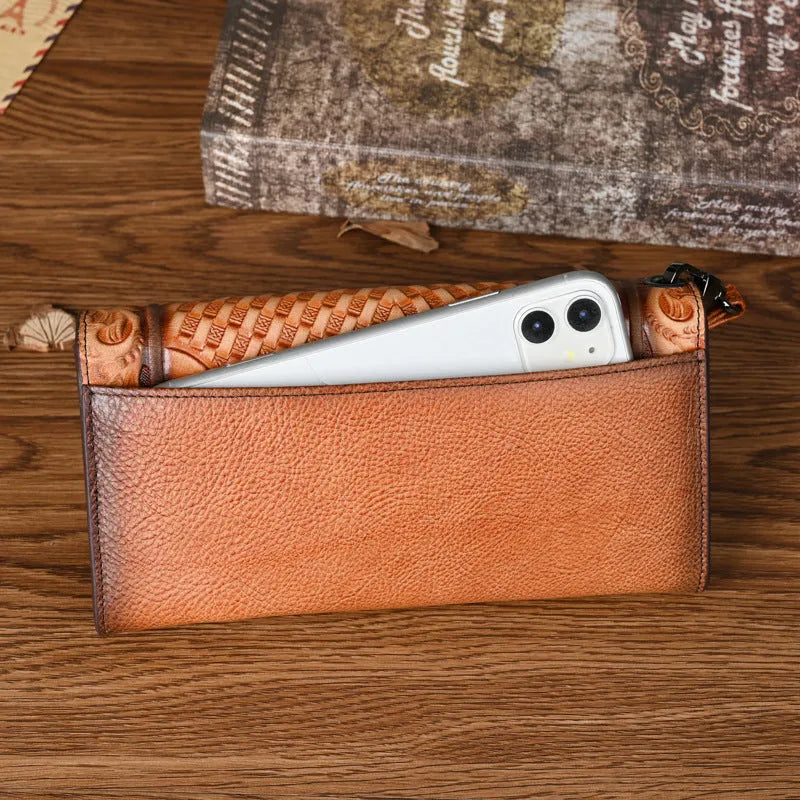 Chinese style embossed women's tri-fold wallet in genuine cowhide leather showing floral pattern detail