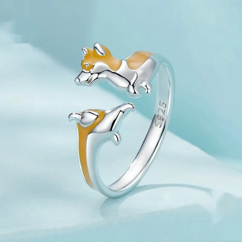 Silver ring with a raised cartoon corgi dog design, electroplated finish.
