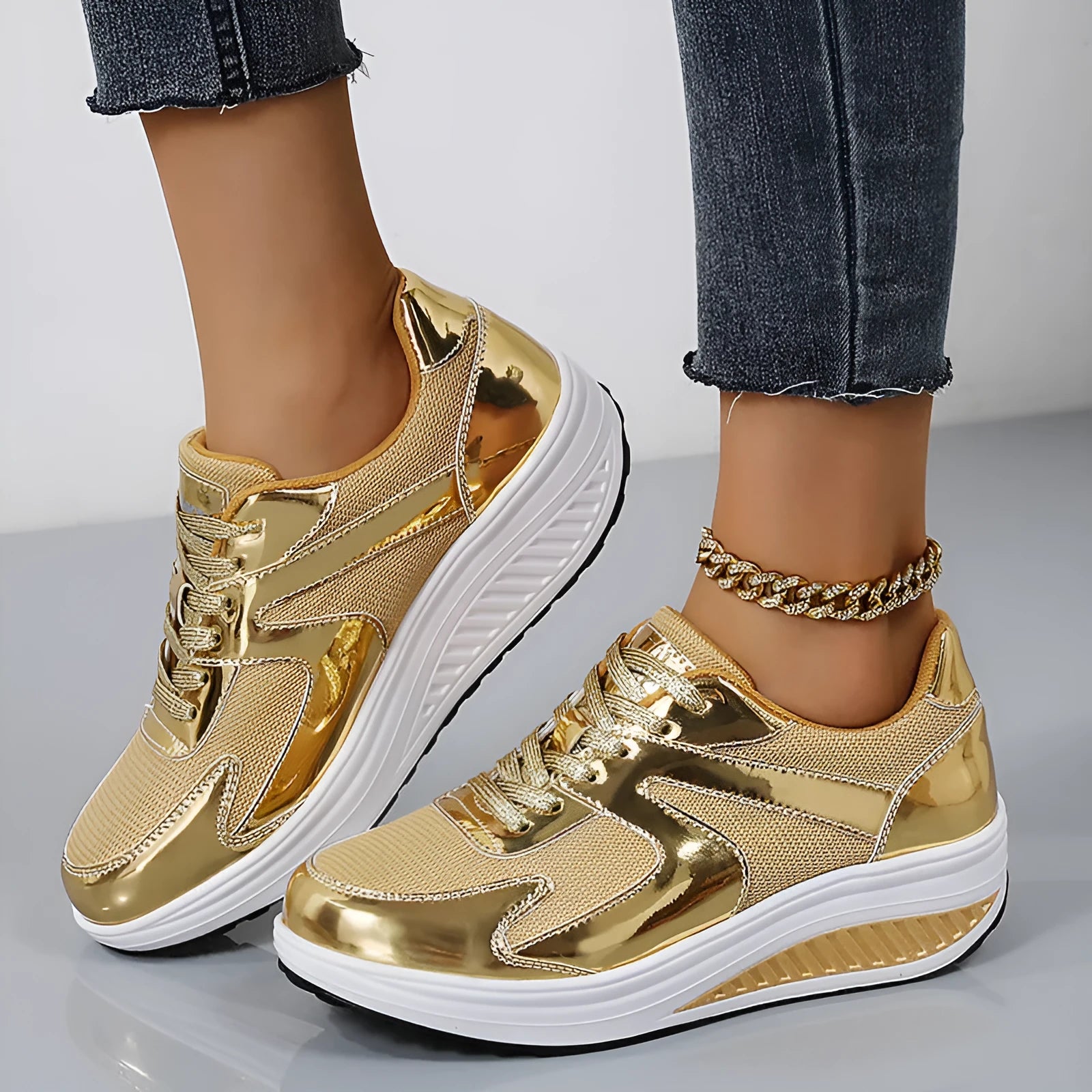 Women's mesh platform shoes with cross strap design in gold colour with waterproof base