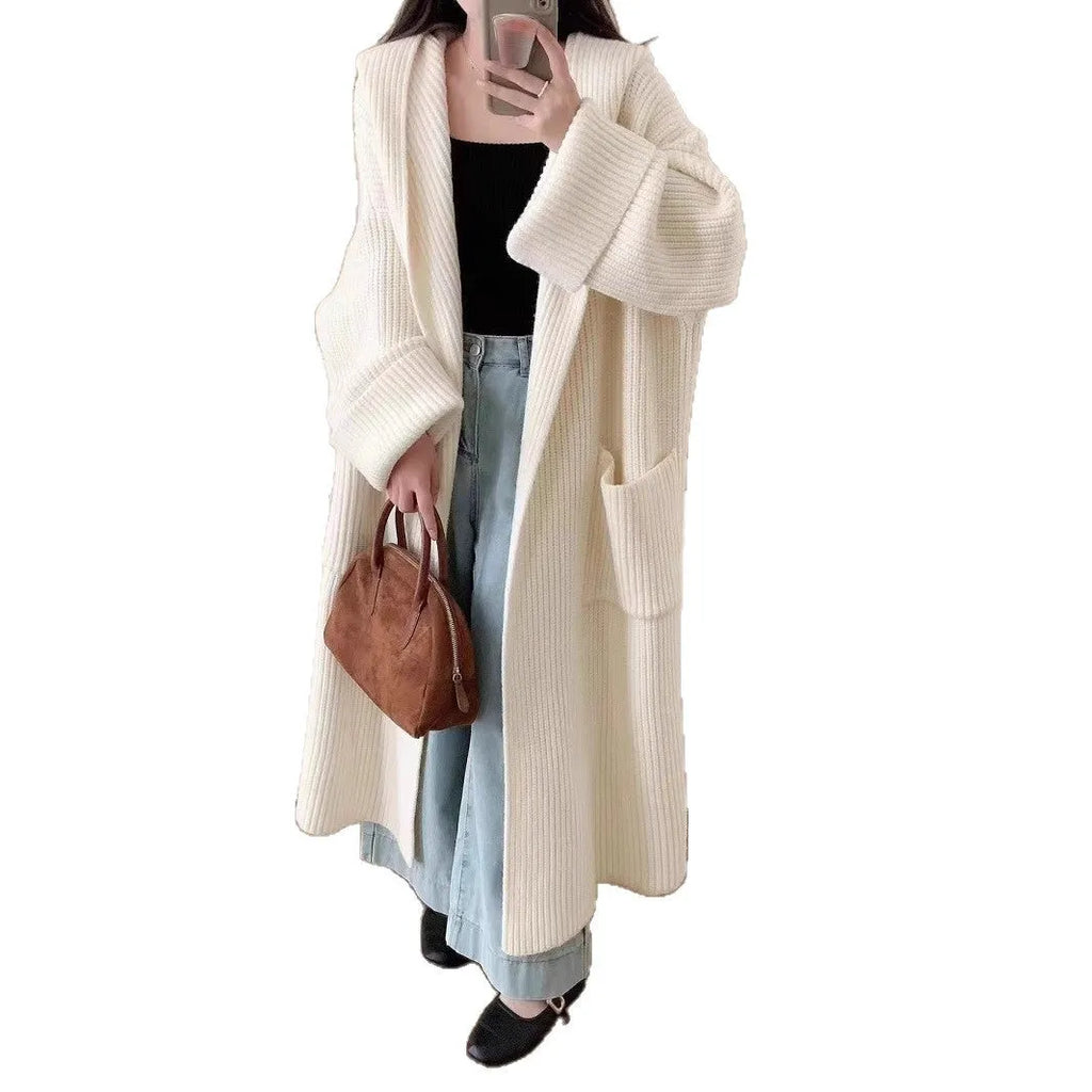 Loose hooded acrylic cardigan sweatshirt in milky white colour showing raglan sleeves and 80cm length