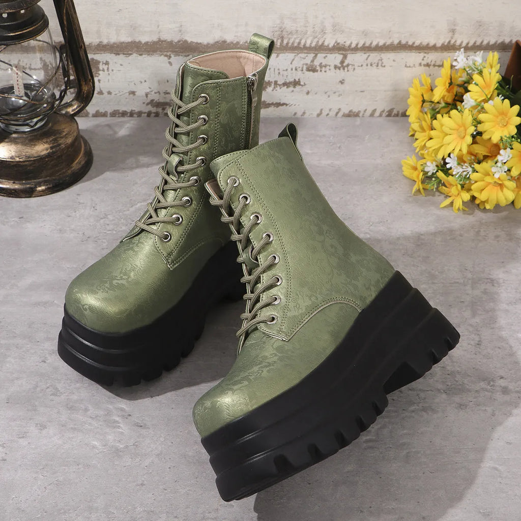 Women's black patchwork platform Martin boots with a chunky heel and side zipper.